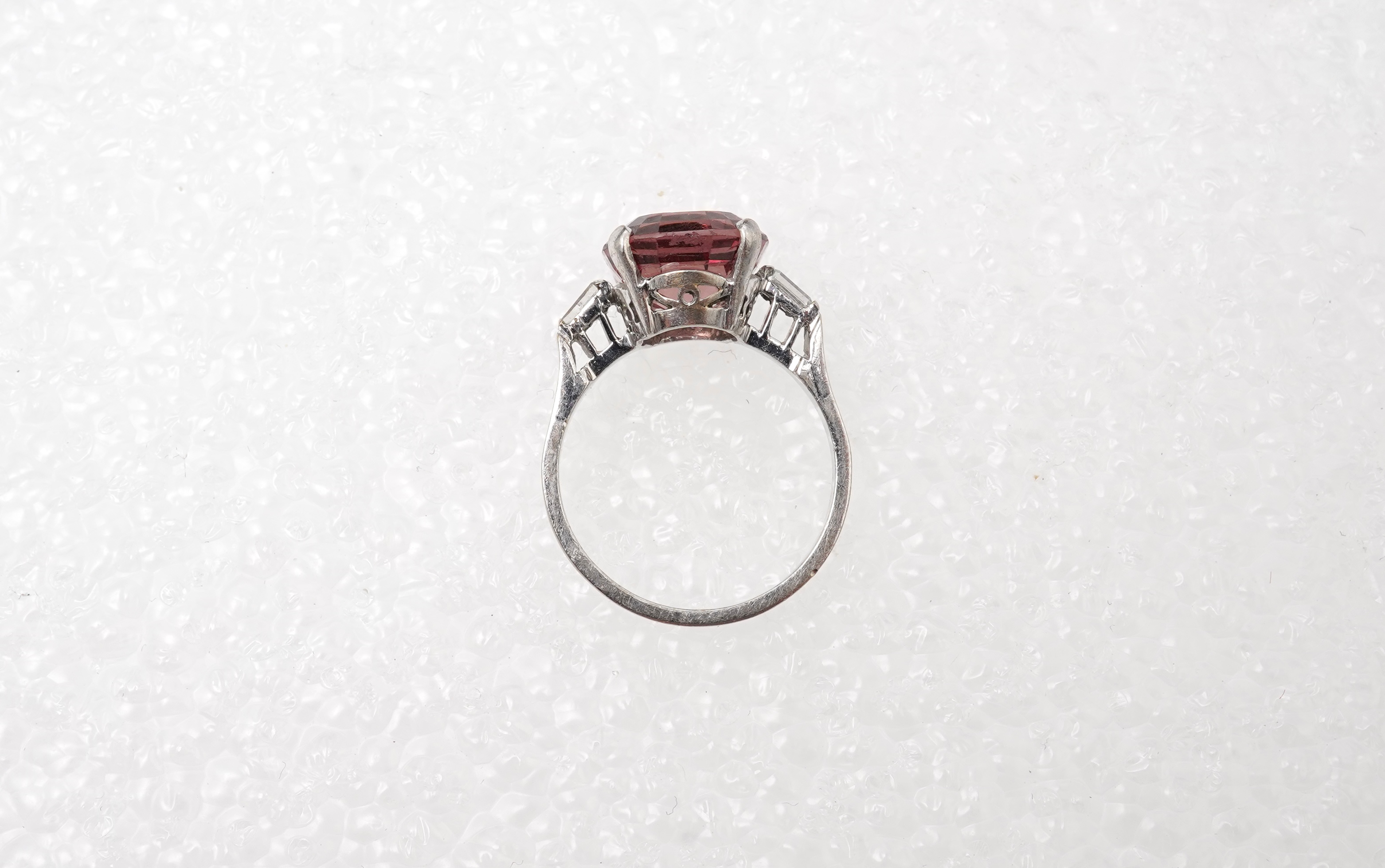 A garnet and diamond ring